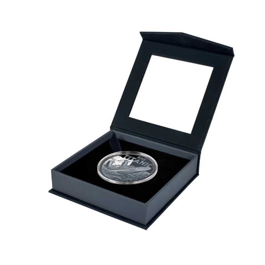 Silver coin in a black display box on a white background