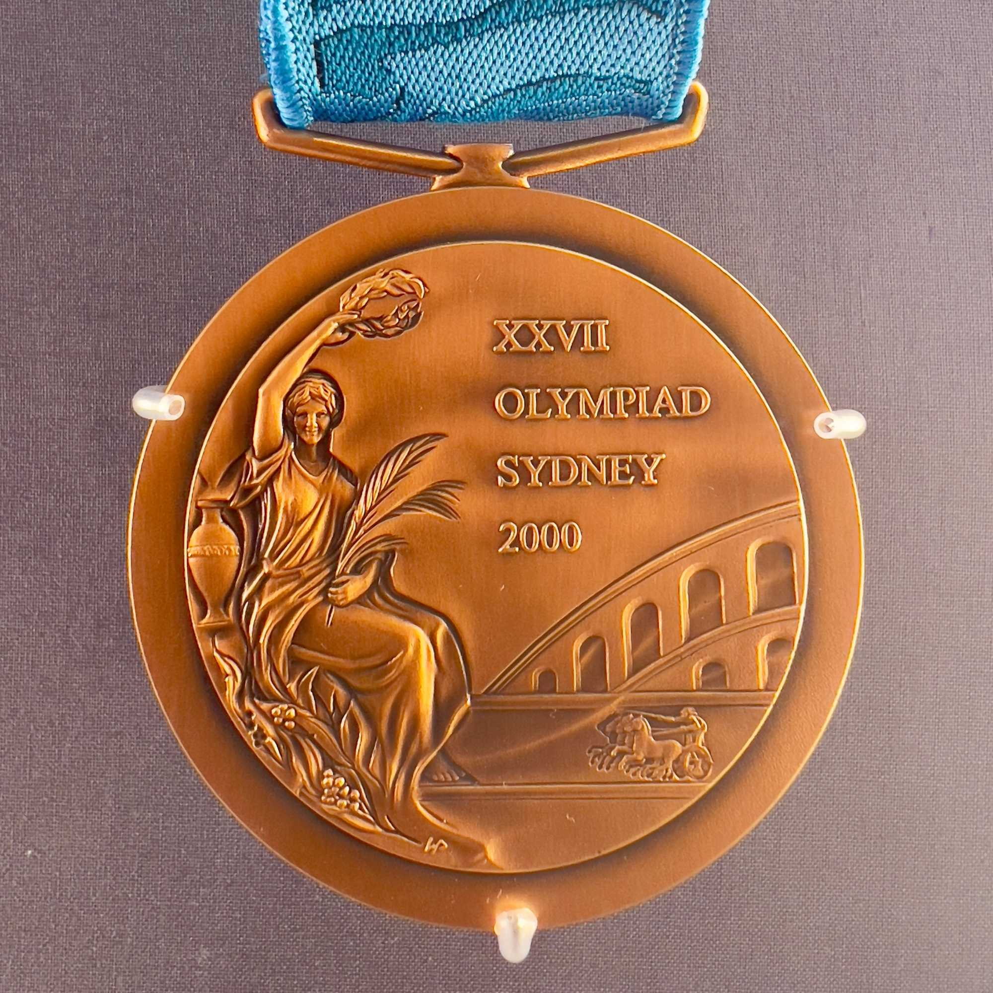 Royal Australian Mint, bronze medal with Sydney 2000 Olympic Games design on a grey background