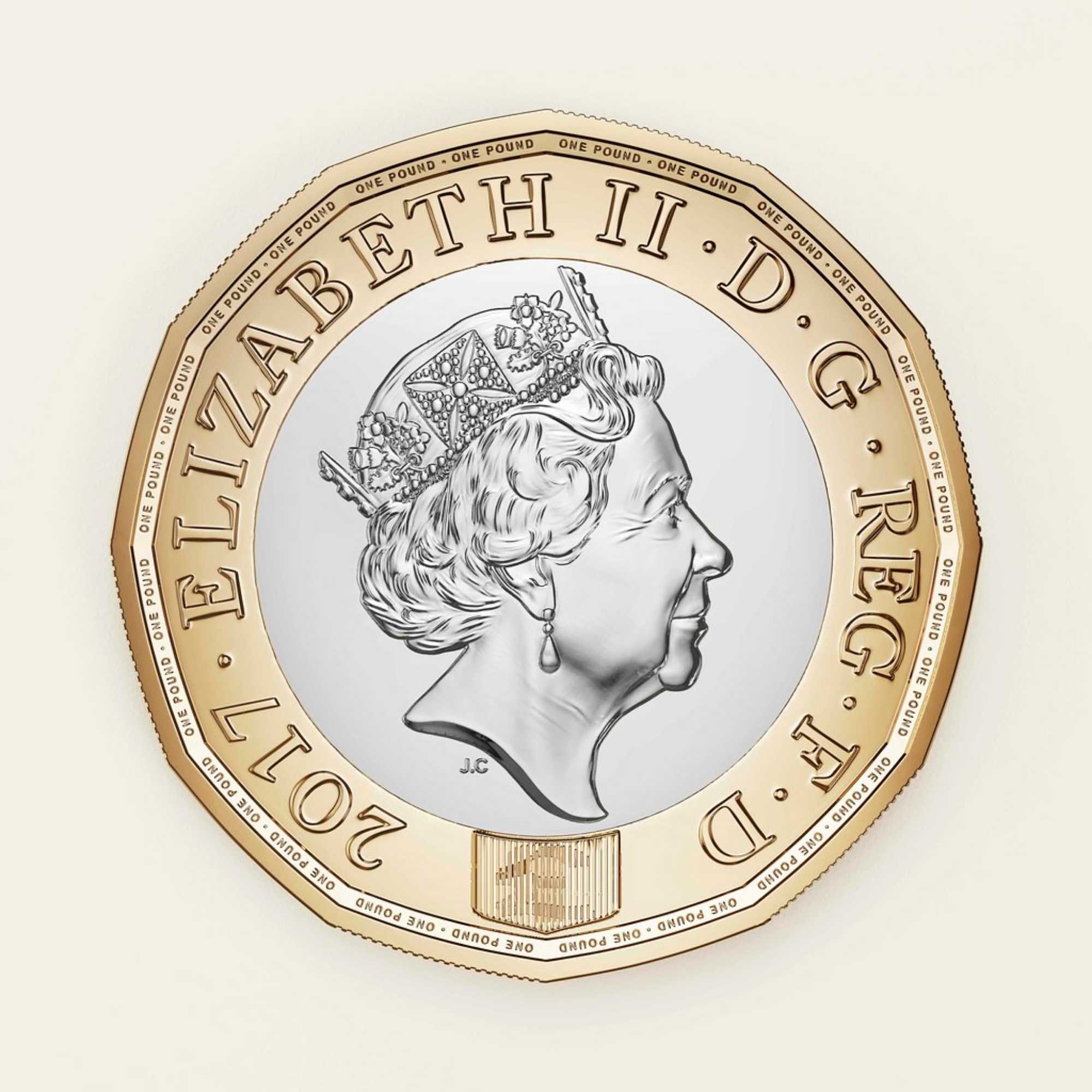 Coin with a portrait of Queen Elizabeth II and engraved text on a white background