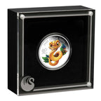 Coin featuring a snake design in a black display case