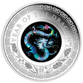 Silver coin with a colorful dragon design and 'Year of the Dragon' text on a white background