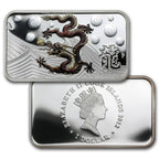 Silver bar with dragon design and engraved text on a white background