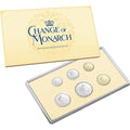 Set of coins in a display case with 'Change of Monarch' packaging on a white background