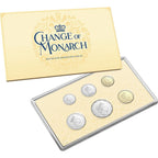 Set of coins in a display case with 'Change of Monarch' packaging on a white background