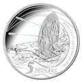 Royal Australian Mint 2007 silver coin with a design of surfers and a lifeboat, featuring the text '5 Dollars' and 'Year of the Surf Life Saver'.