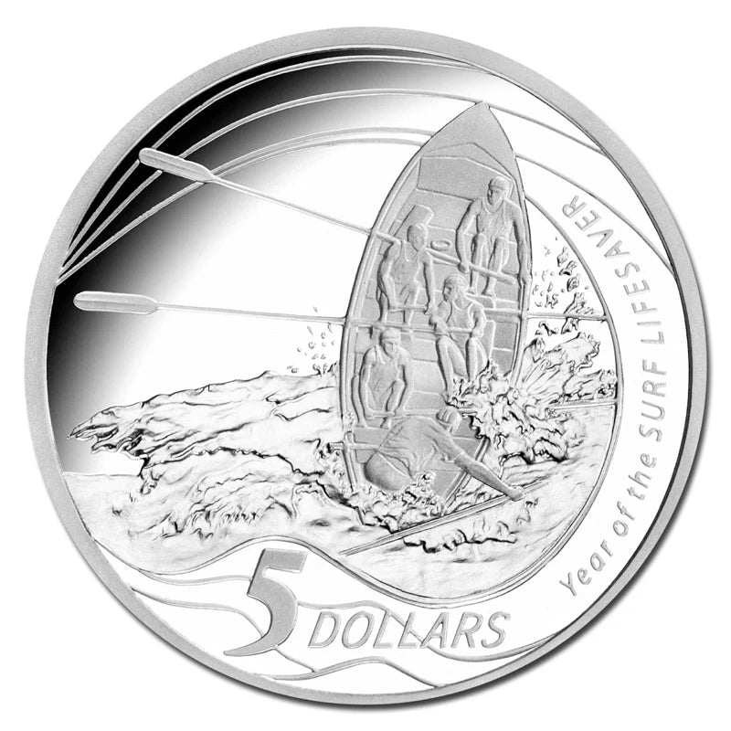 Royal Australian Mint 2007 silver coin with a design of surfers and a lifeboat, featuring the text '5 Dollars' and 'Year of the Surf Life Saver'.