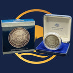 Royal Australian Mint 2006 Pillar Dollar silver coin in a display case with packaging featuring Australian government branding.