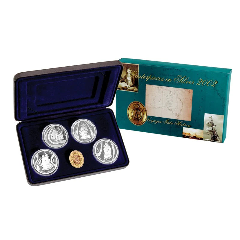 Royal Australian Mint set of silver coins in an open display case, accompanied by a green box labelled 'Masterpieces in Silver 2002'.