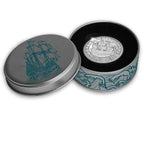 2024 official restrike "Scheepjesschelling" two-ounce silver coin from the Royal Dutch Mint in a decorative tin with a ship design on a white background